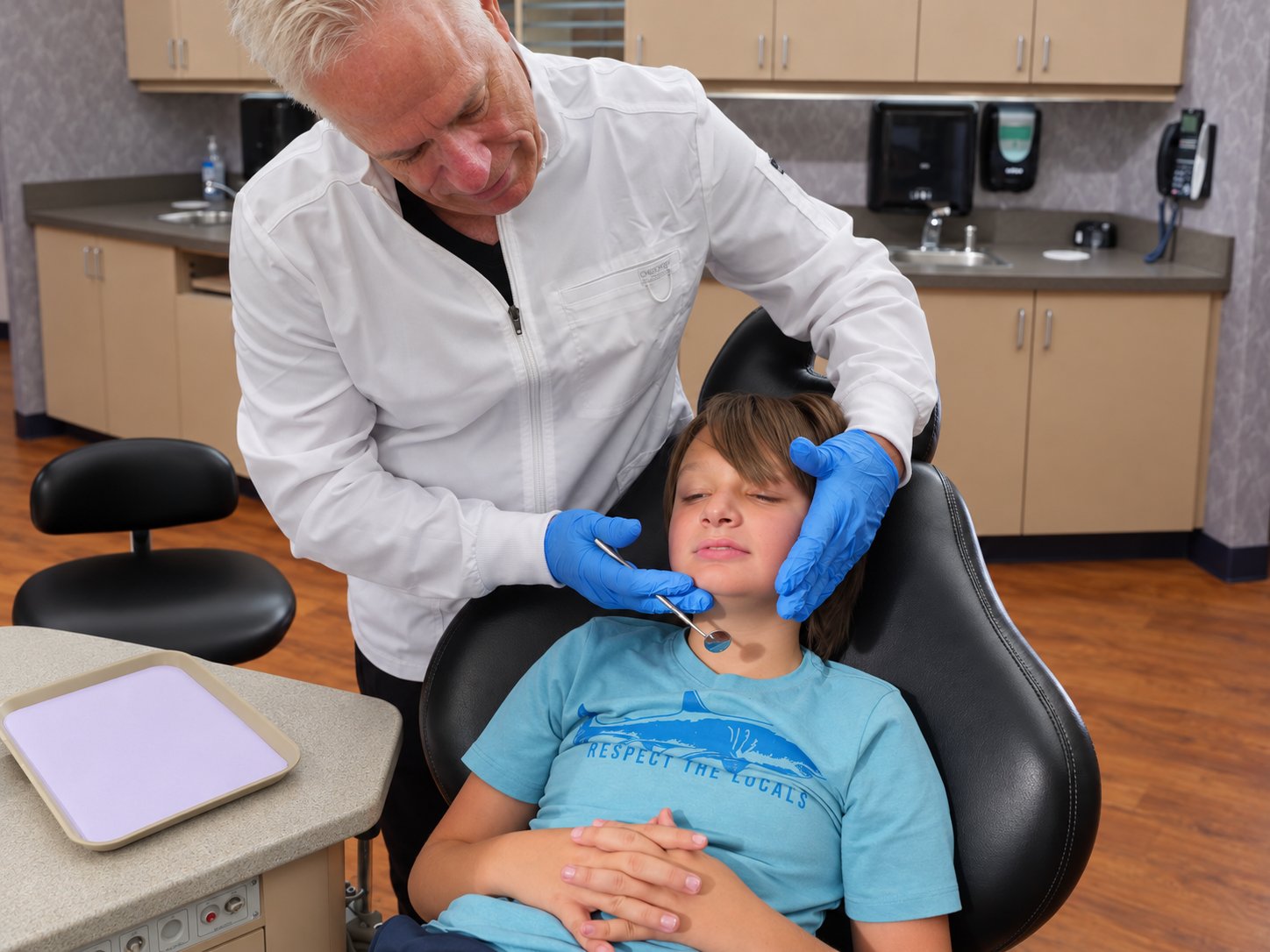 Dr. Roeder examining a young patient in the treatment chair