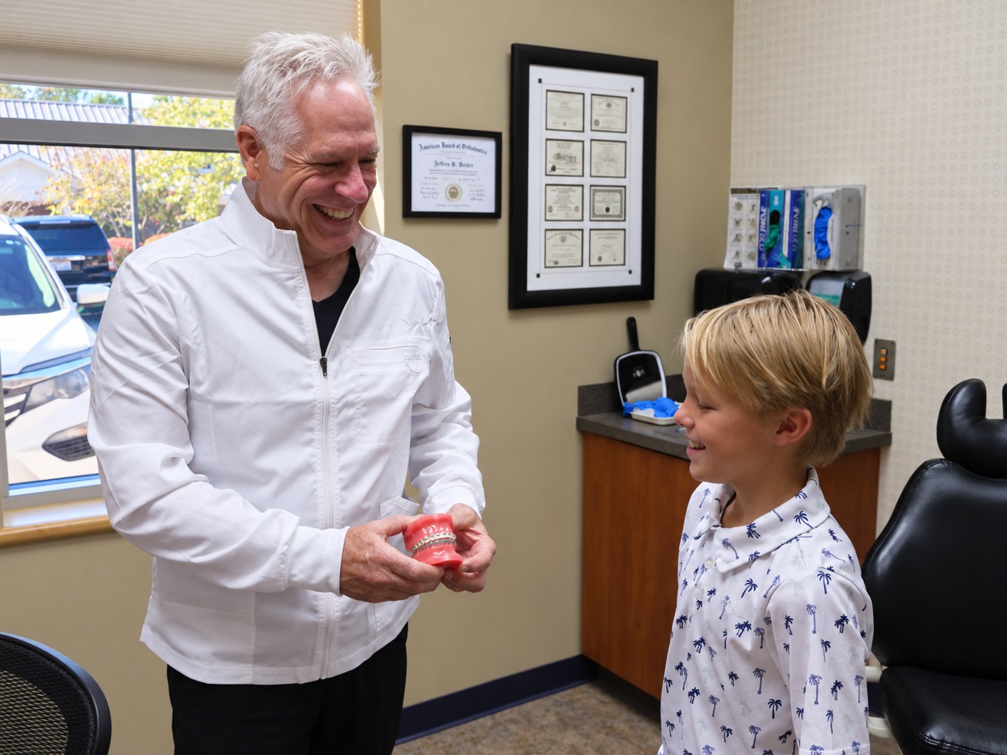 Dr. Roeder talking with a young patient in the office